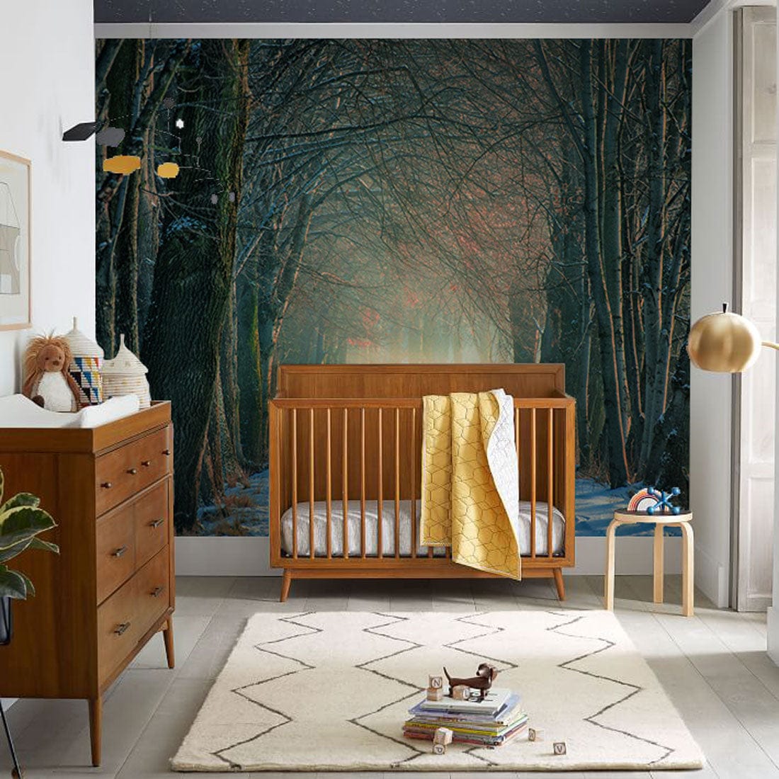 Wallpaper mural of a snowy path through the woods, ideal for a nursery