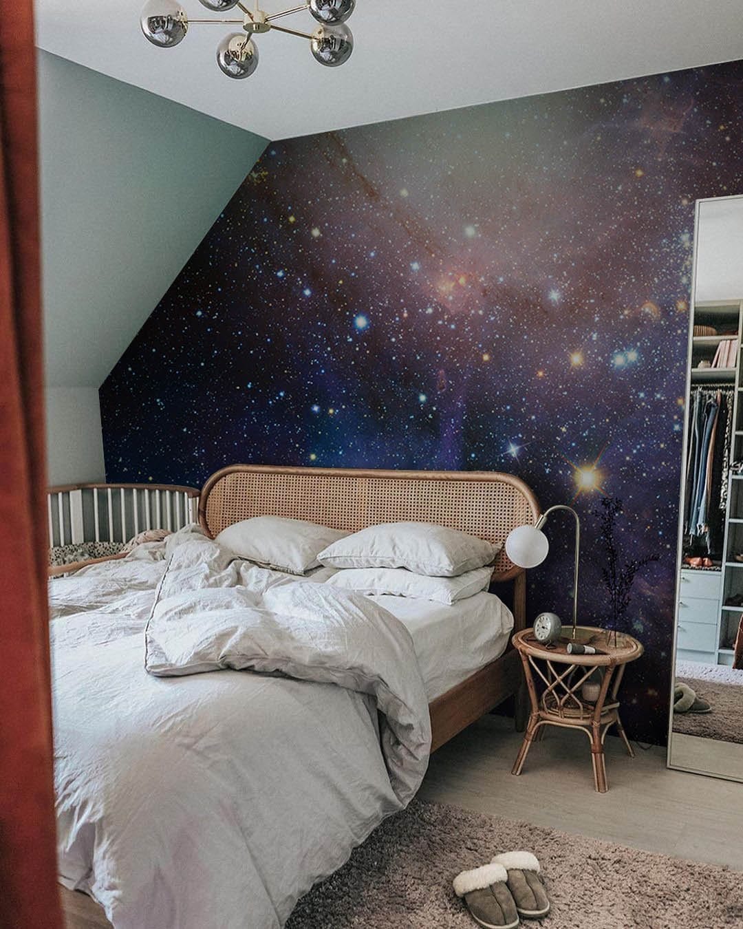 Wallpaper mural for the bedroom that features a lovely purple galaxy.