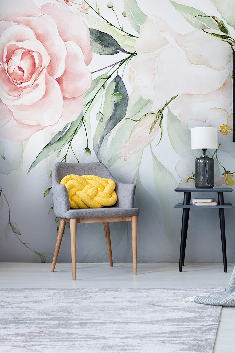 Wallpaper with a mural depicting spring flowers; pastel pink furnishings and accessories