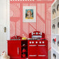 Wall mural design for the kitchen featuring precise pink machine lines