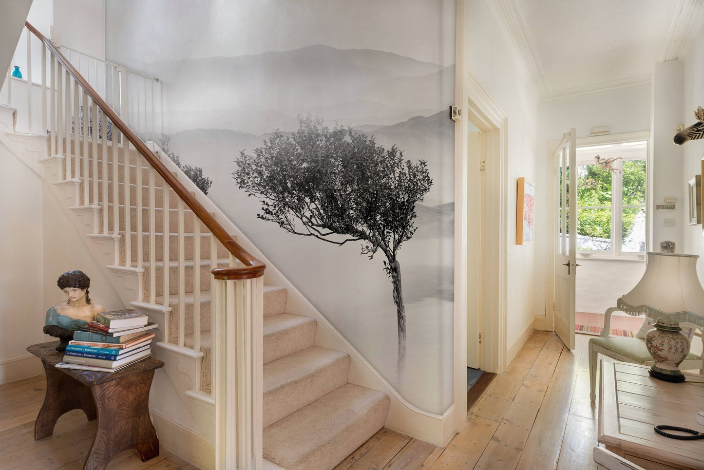 Wallpaper mural for room decoration including desolate trees and a lake.