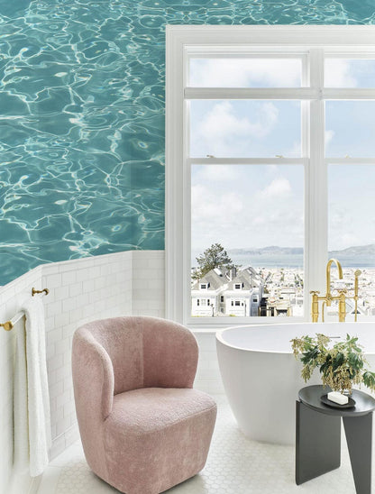 Wallpaper mural with turquoise ocean waves, perfect for use as bathroom decor.