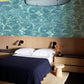 Wallpaper mural featuring turquoise ocean waves, perfect for use as bedroom decor.