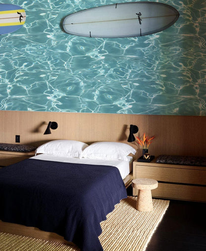 Wallpaper mural featuring turquoise ocean waves, perfect for use as bedroom decor.