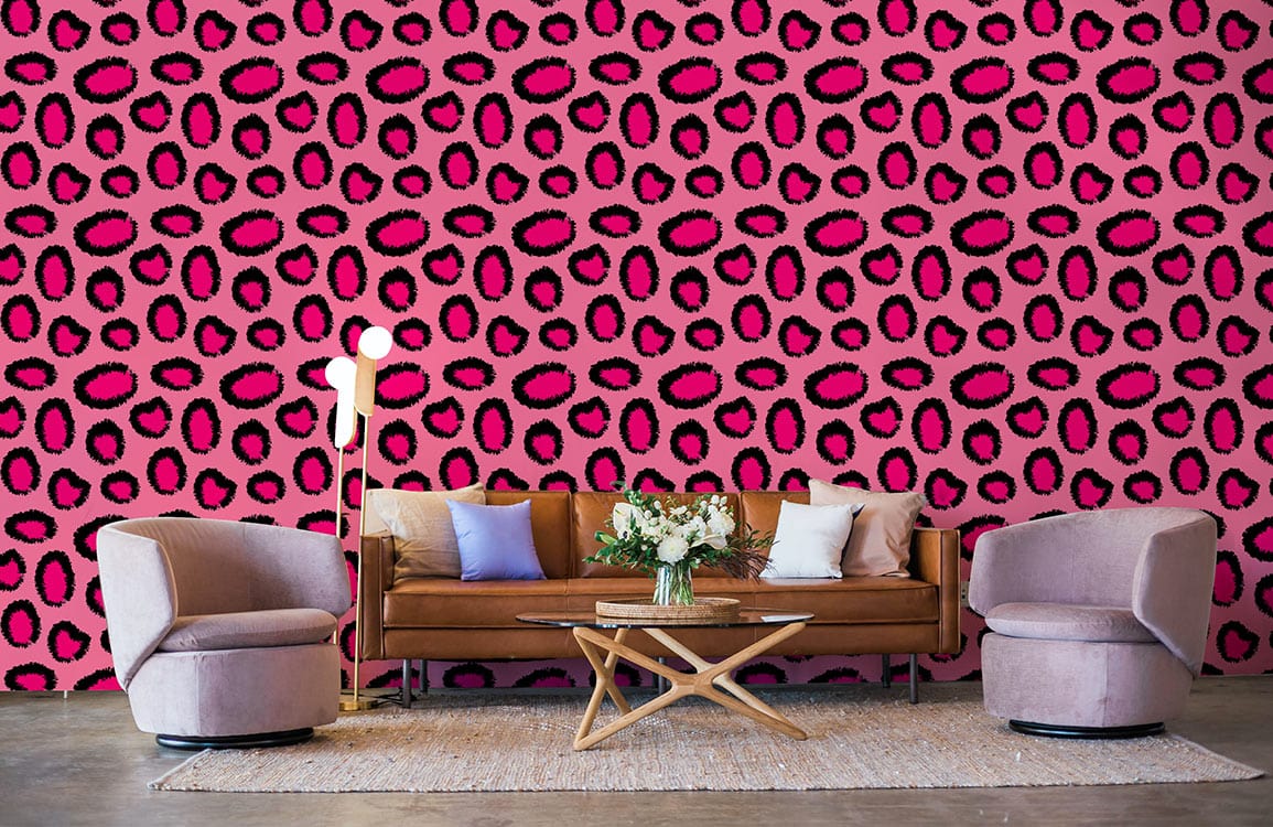 a mural of pink and leopard pattern cell wallpaper to decorate the living room.