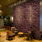Wallpaper mural depicting pink furry animals used for decorating coffee shops.