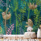 A wallpaper mural for a child's room that depicts a sloth having fun on vines.