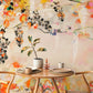 A mural in the dining room wall that has flowers painted in watercolour