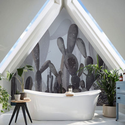 A watercolour cactus design was printed as a mural on wallpaper and installed in the bathroom.