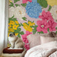 Wallpaper mural featuring an array of colorful flowers, perfect for decorating a bedroom