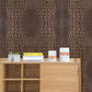 Use a vertical wallpaper mural of a brown python skin animal for the decoration of your hallway.