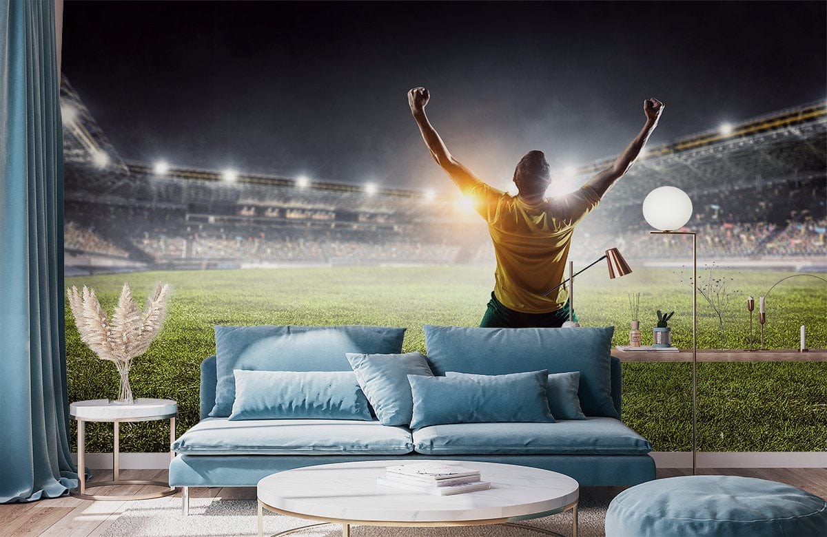 Wallpaper Mural of a Winning Soccer Player Located in the Living Room