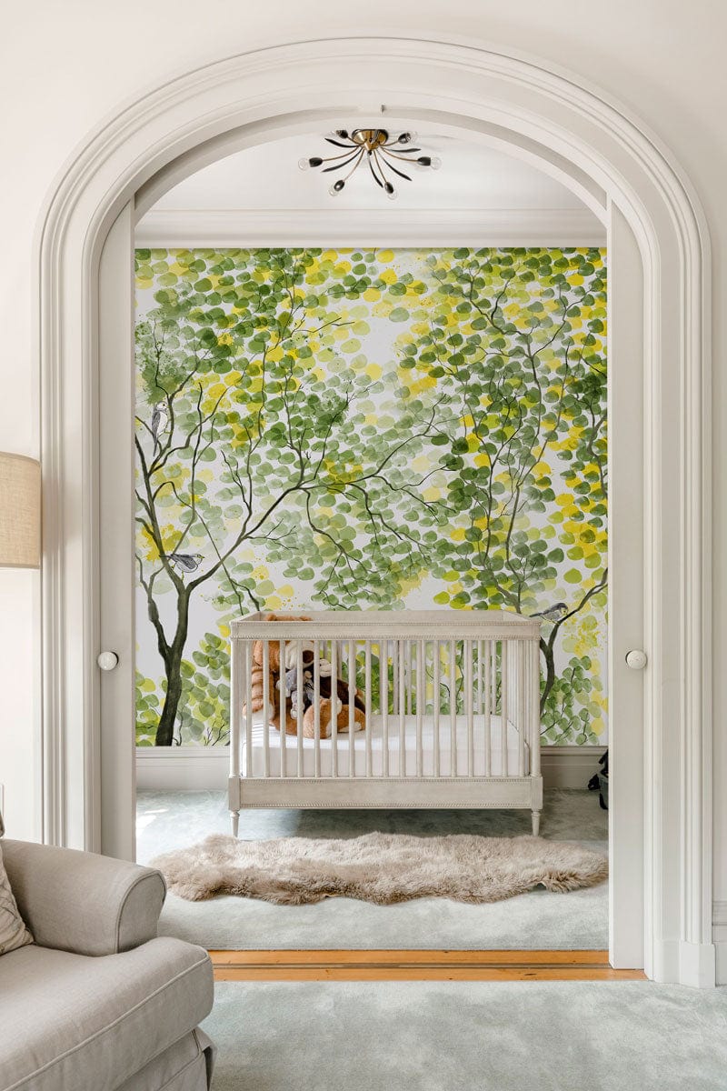 Wallpaper mural with a watercolor painting of spring trees, perfect for decorating a nursery.