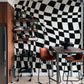 Wallpaper mural featuring a wavy checkerboard grid for use in the dining room's decor.