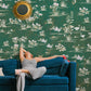 Decorate your living room with this mural of wild flowers on a green wallpaper.